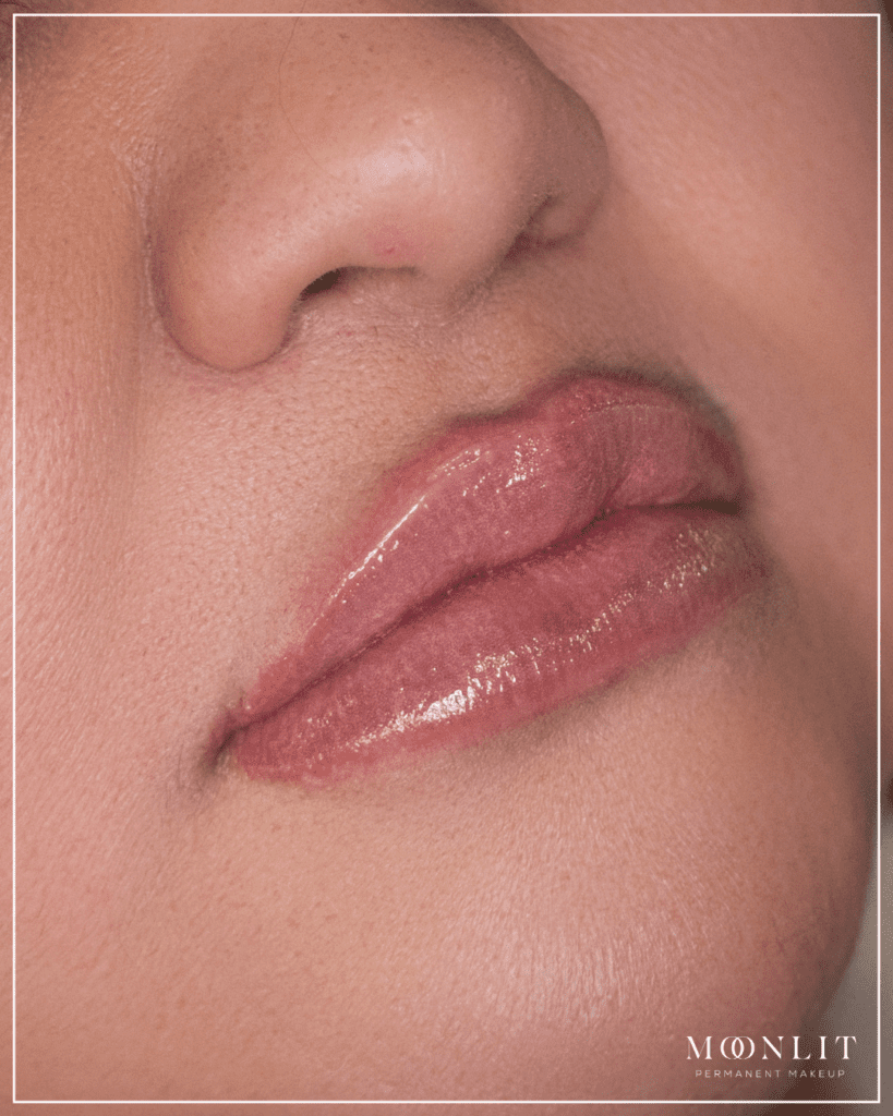 Lip blush for dark lips neutralization, healed glossy lips with softened pigmentation and even tone by Salt Lake City PMU artist, warm pink correction result, Salt Lake City, Utah