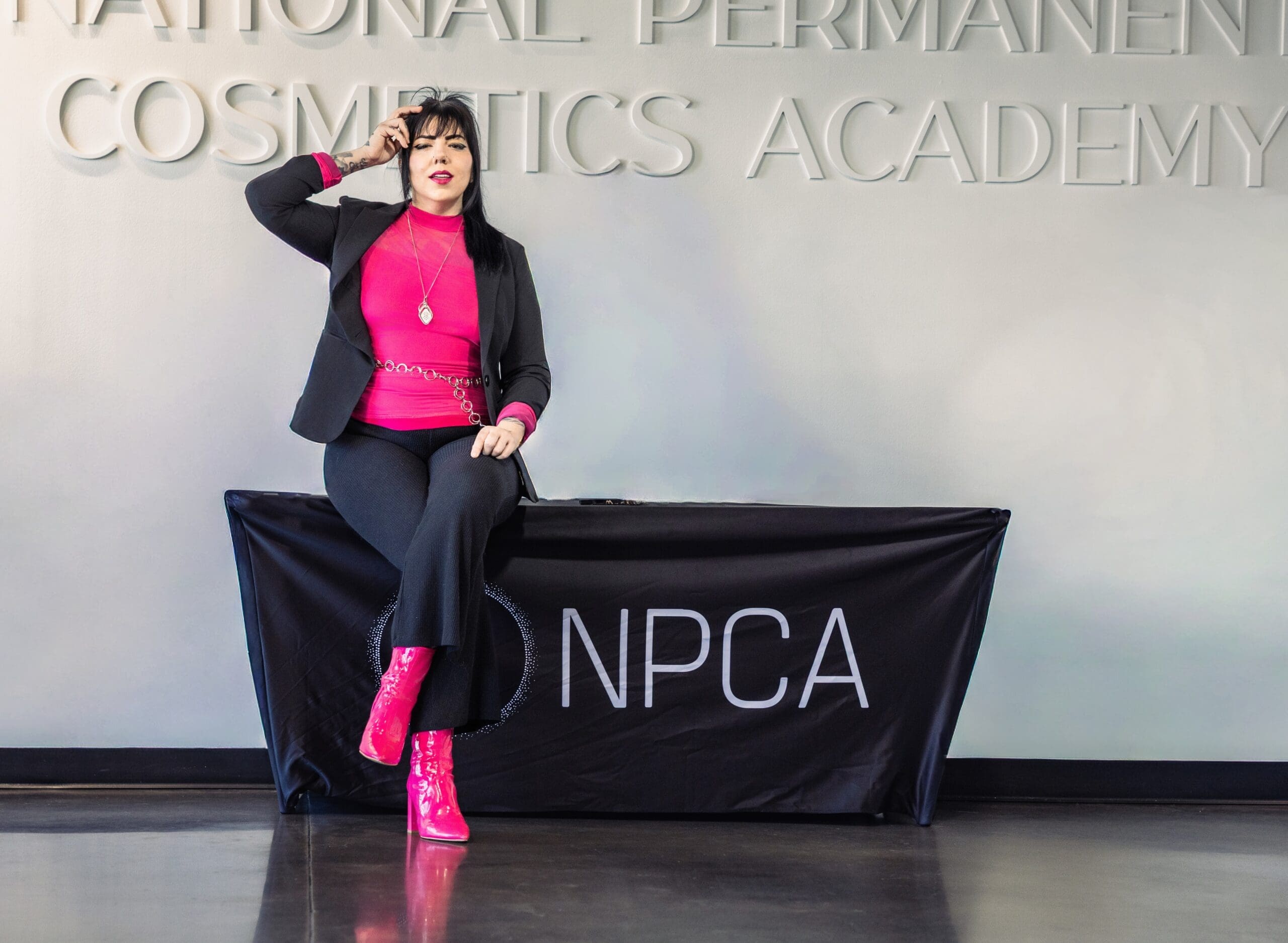 Salt Lake City paramedical tattoo artist Alison Daigle sitting in a professional permanent makeup training studio specializing in scar camouflage, stretch mark camouflage, restorative tattooing, and advanced skin tone blending services.